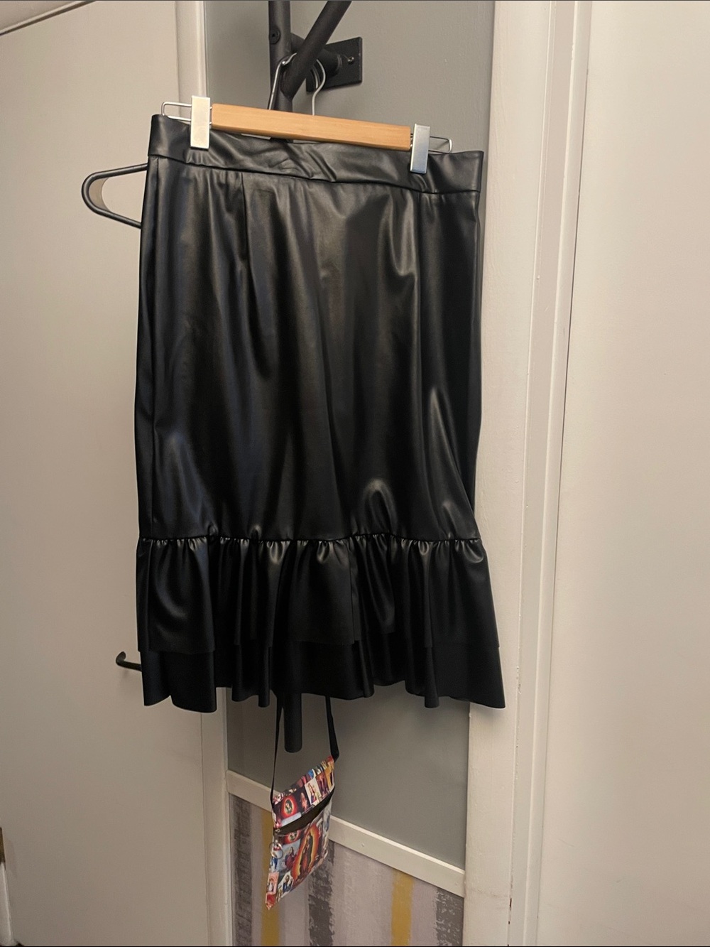 Sleek Black Faux Leather Midi Skirt with Ruffle Hem
